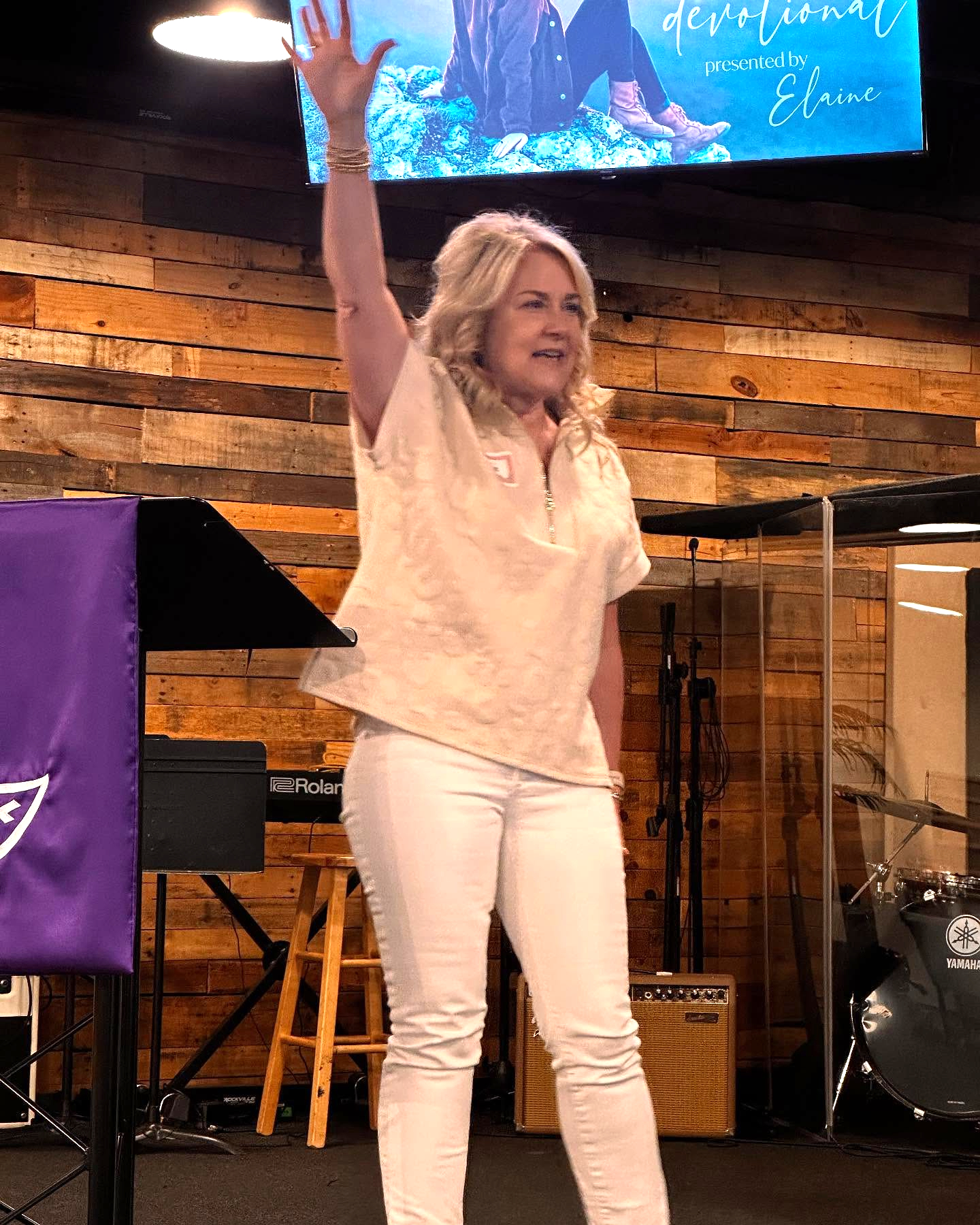 A speaker on stage at MomCo South
